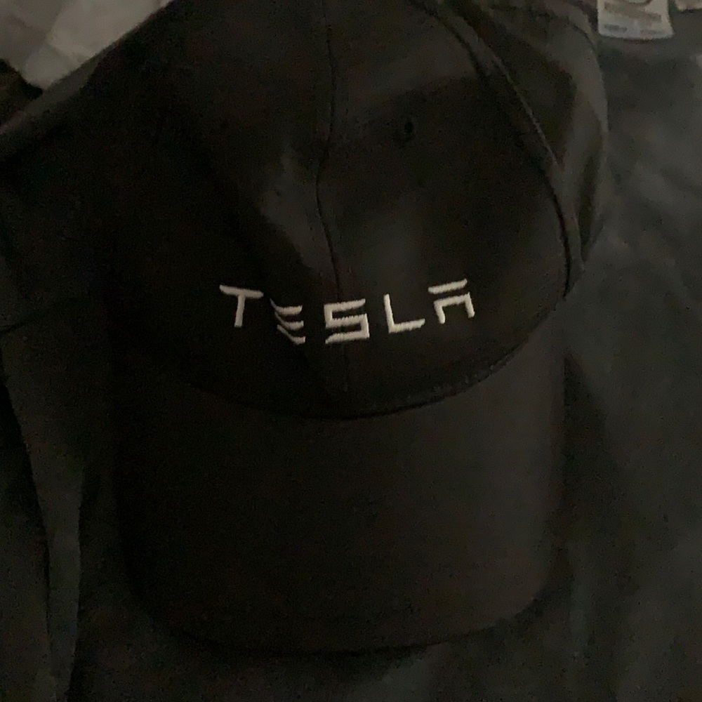 2 short sleeved shirts and a hat medium